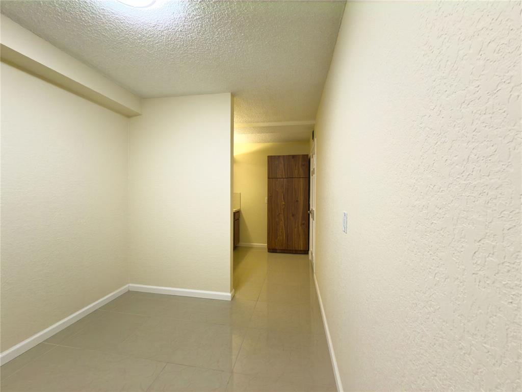 1701 Whitehall Drive, Unit 303 Davie, FL 33324 - Photo 16 of 33 a view of an empty room