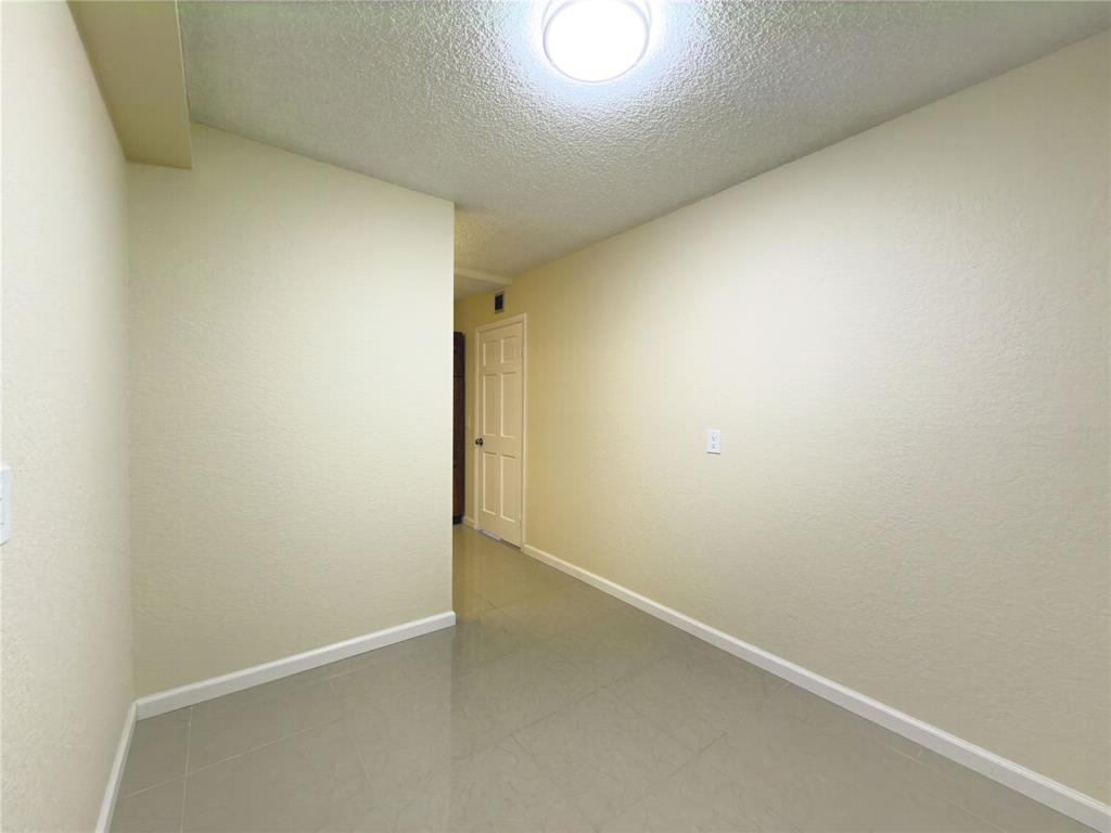 1701 Whitehall Drive, Unit 303 Davie, FL 33324 - Photo 18 of 33 a view of an empty room