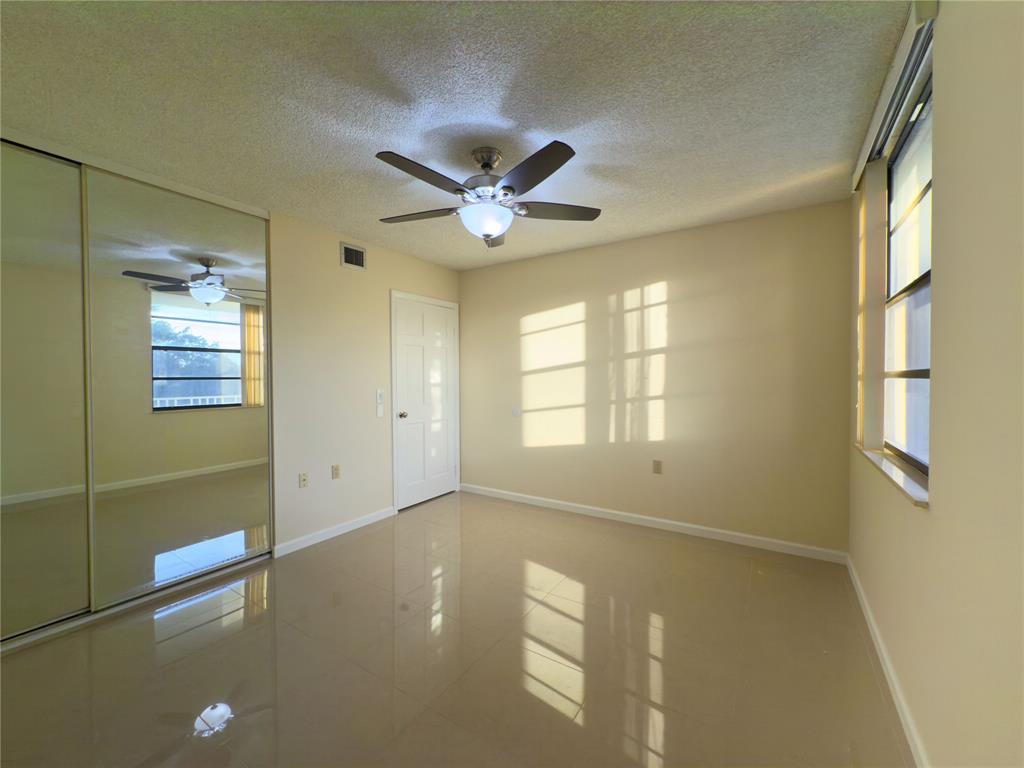 1701 Whitehall Drive, Unit 303 Davie, FL 33324 - Photo 20 of 33 a view of an empty room with a window