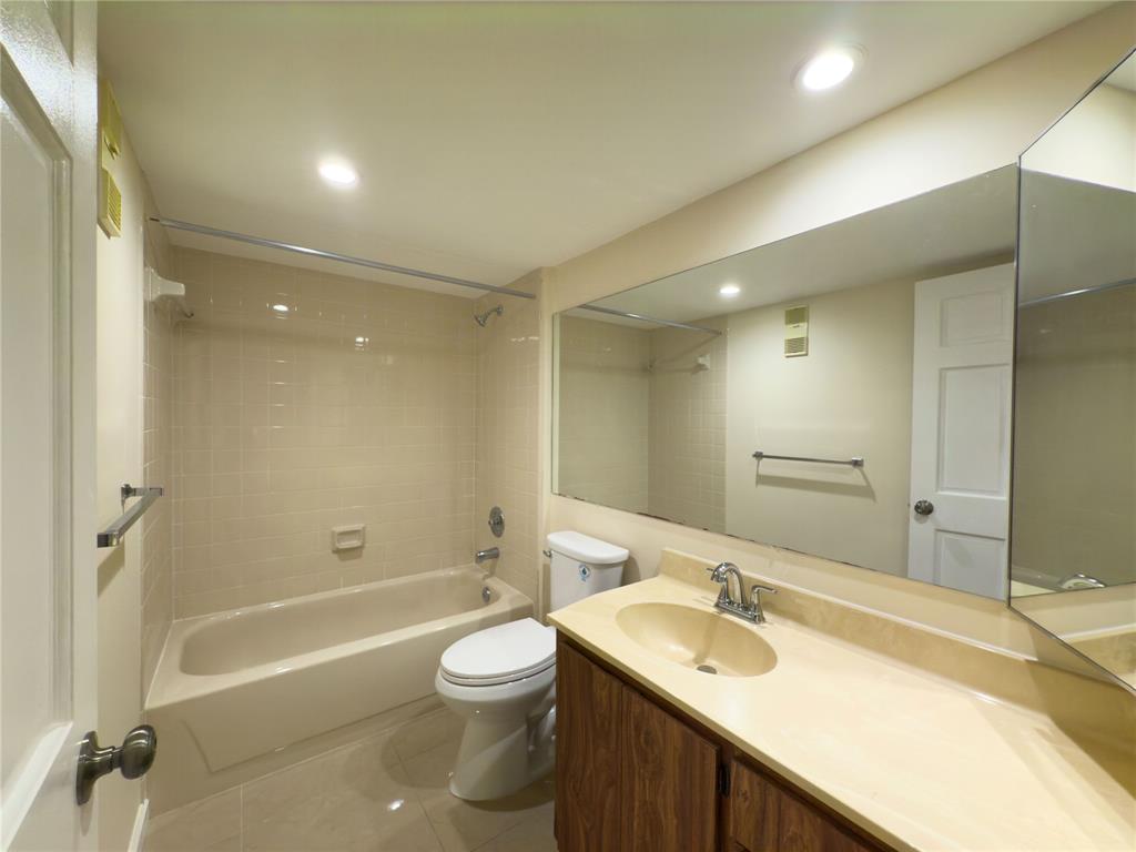 1701 Whitehall Drive, Unit 303 Davie, FL 33324 - Photo 21 of 33 a bathroom with a sink double vanity granite toilet tub and shower