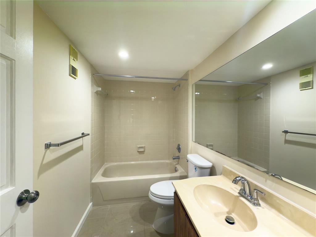 1701 Whitehall Drive, Unit 303 Davie, FL 33324 - Photo 22 of 33 a bathroom with a sink toilet and shower