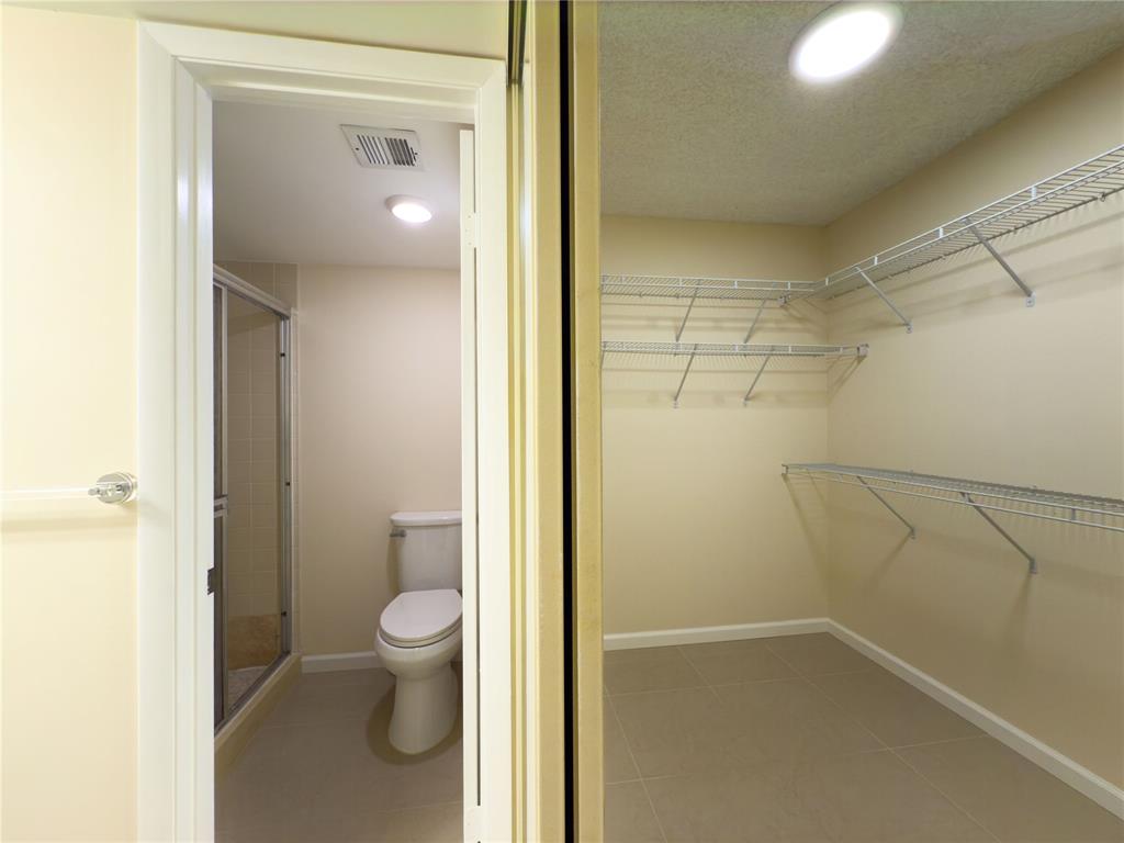 1701 Whitehall Drive, Unit 303 Davie, FL 33324 - Photo 29 of 33 a view of a bathroom from a hallway