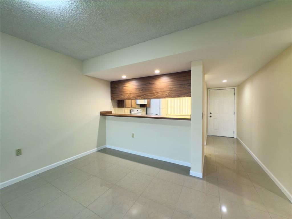 1701 Whitehall Drive, Unit 303 Davie, FL 33324 - Photo 8 of 33 a view of an empty room