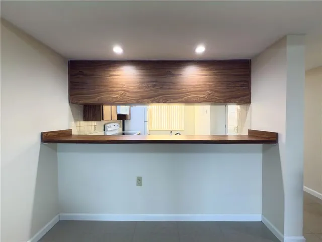 a kitchen with a sink cabinets and appliances