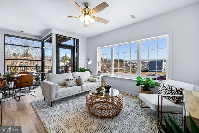 a living room with furniture and a large window