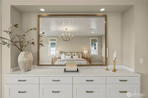 a view of a hallway with mirror and window