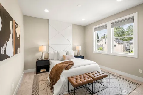 a bedroom with a bed and window