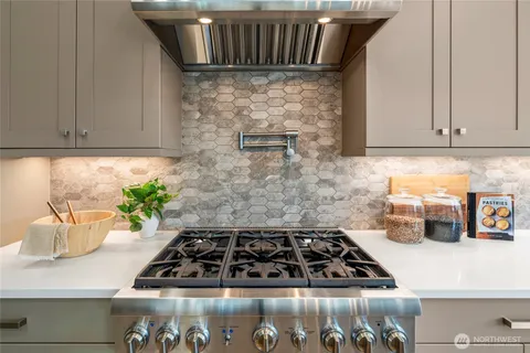 a kitchen with a stove and cabinets