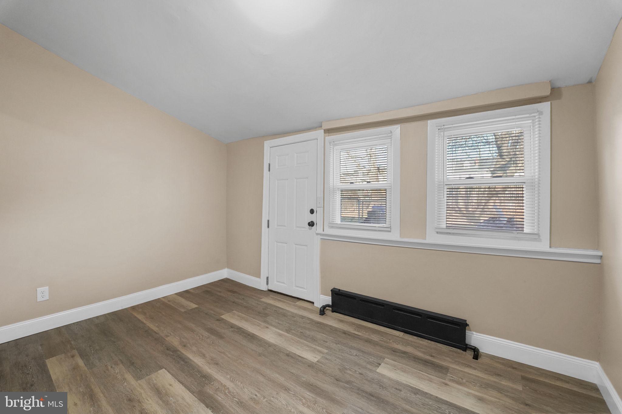 237 Morris Street Gloucester City, NJ 08030 - Photo 15 of 44 wooden floor in an empty room with a window