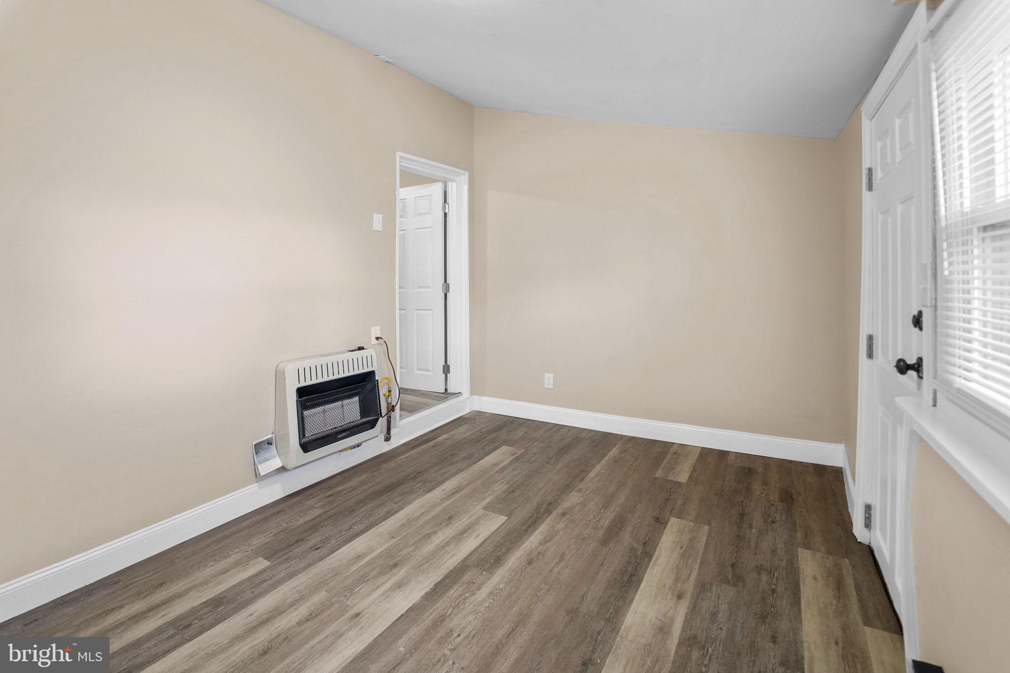 237 Morris Street Gloucester City, NJ 08030 - Photo 17 of 44 a view of a room with wooden floor and electronic appliances