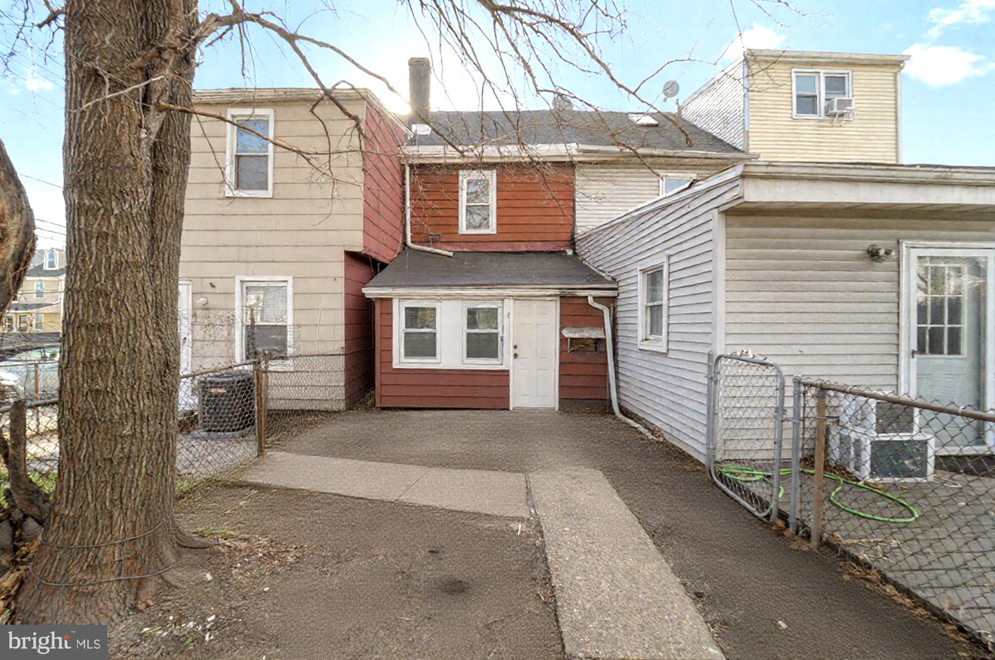 237 Morris Street Gloucester City, NJ 08030 - Photo 40 of 44 a front view of a house with a large tree