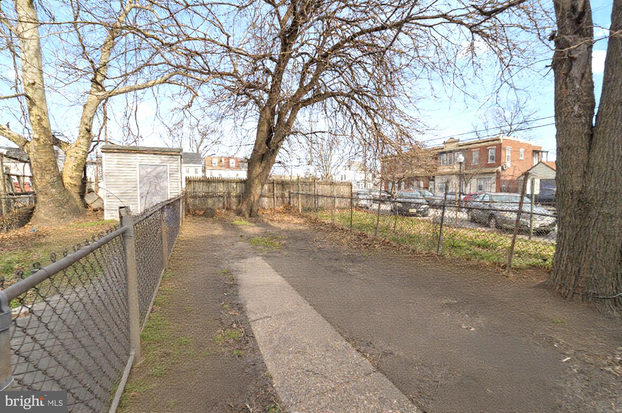 237 Morris Street Gloucester City, NJ 08030 - Photo 42 of 44 a view of a pathway with a wrought fence