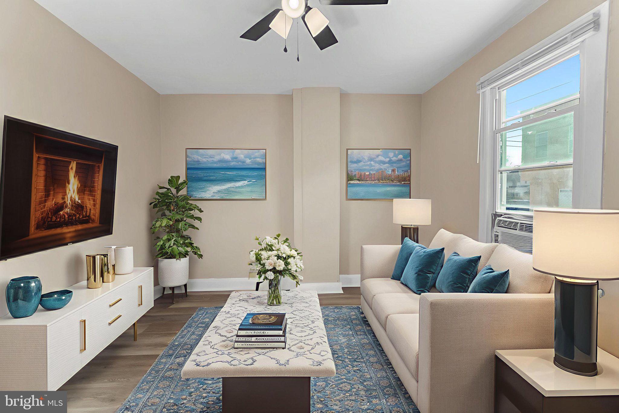 237 Morris Street Gloucester City, NJ 08030 - Photo 7 of 44 a living room with furniture a rug and a flat screen tv