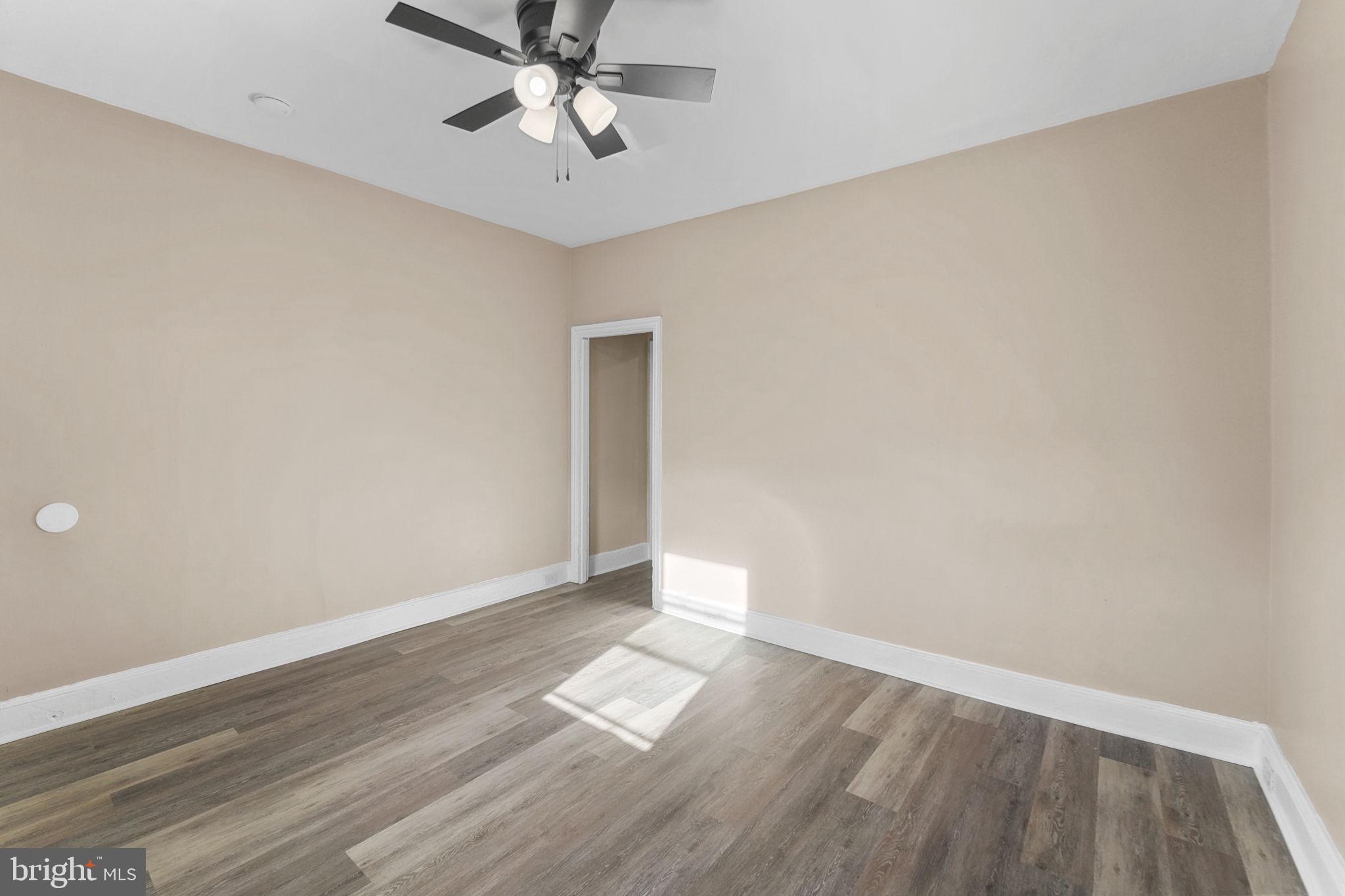 237 Morris Street Gloucester City, NJ 08030 - Photo 9 of 44 an empty room with wooden floor and windows