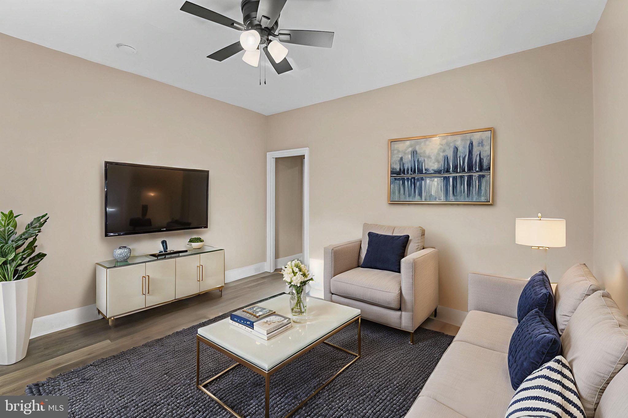 237 Morris Street Gloucester City, NJ 08030 - Photo 10 of 44 a living room with furniture and a flat screen tv