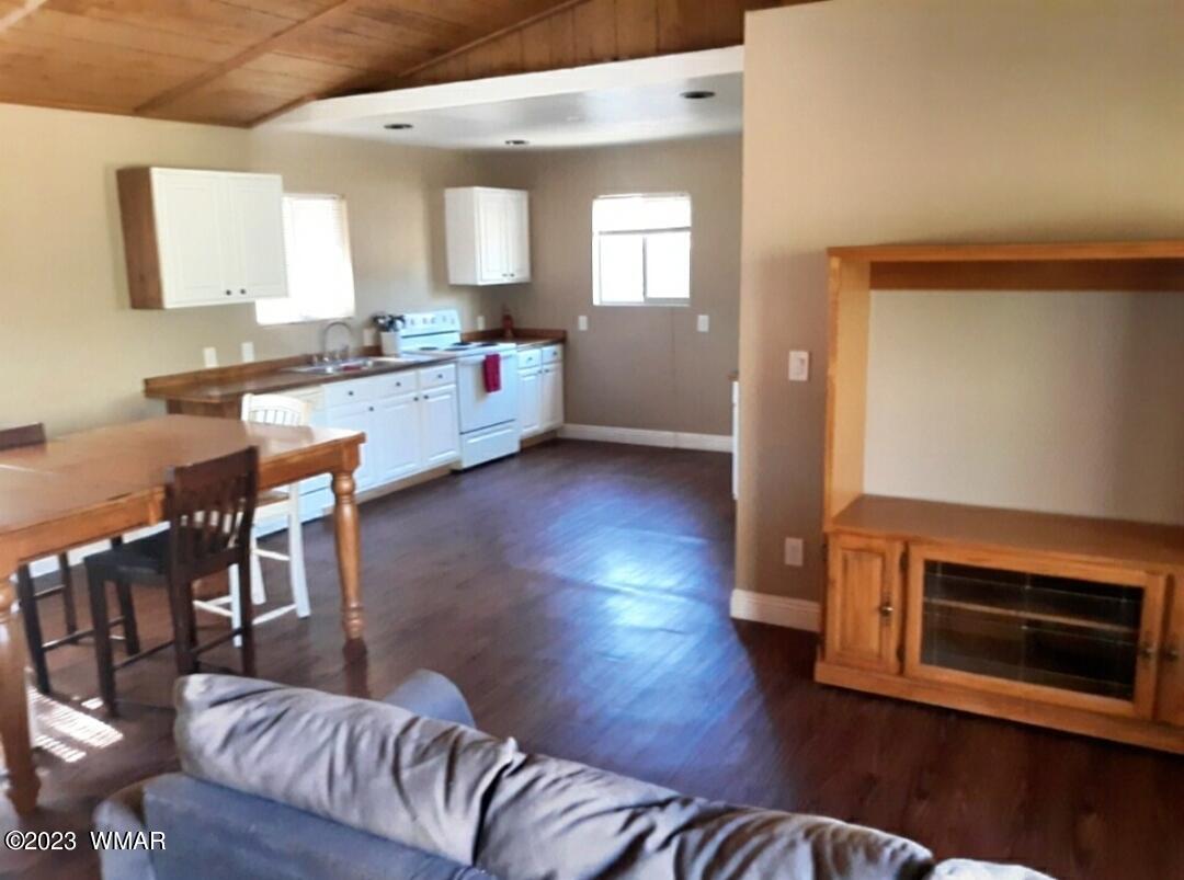 3521 Deer Track Trail Overgaard, AZ 85933 - Photo 3 of 7 a living room with furniture and a wooden floor