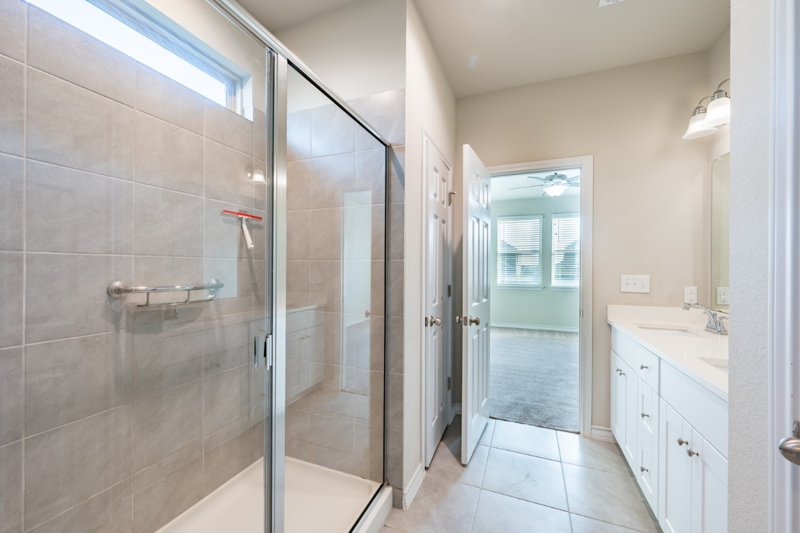 1325 Eagle Ray Street Leander, TX 78641 - Photo 10 of 16 a bathroom with a shower and a sink