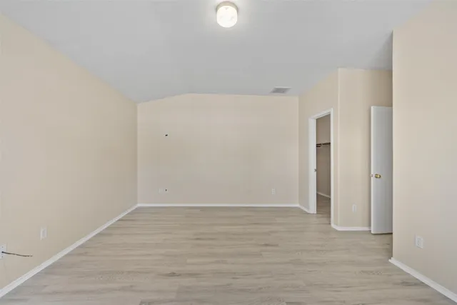 a white bath tub sitting next to a shower