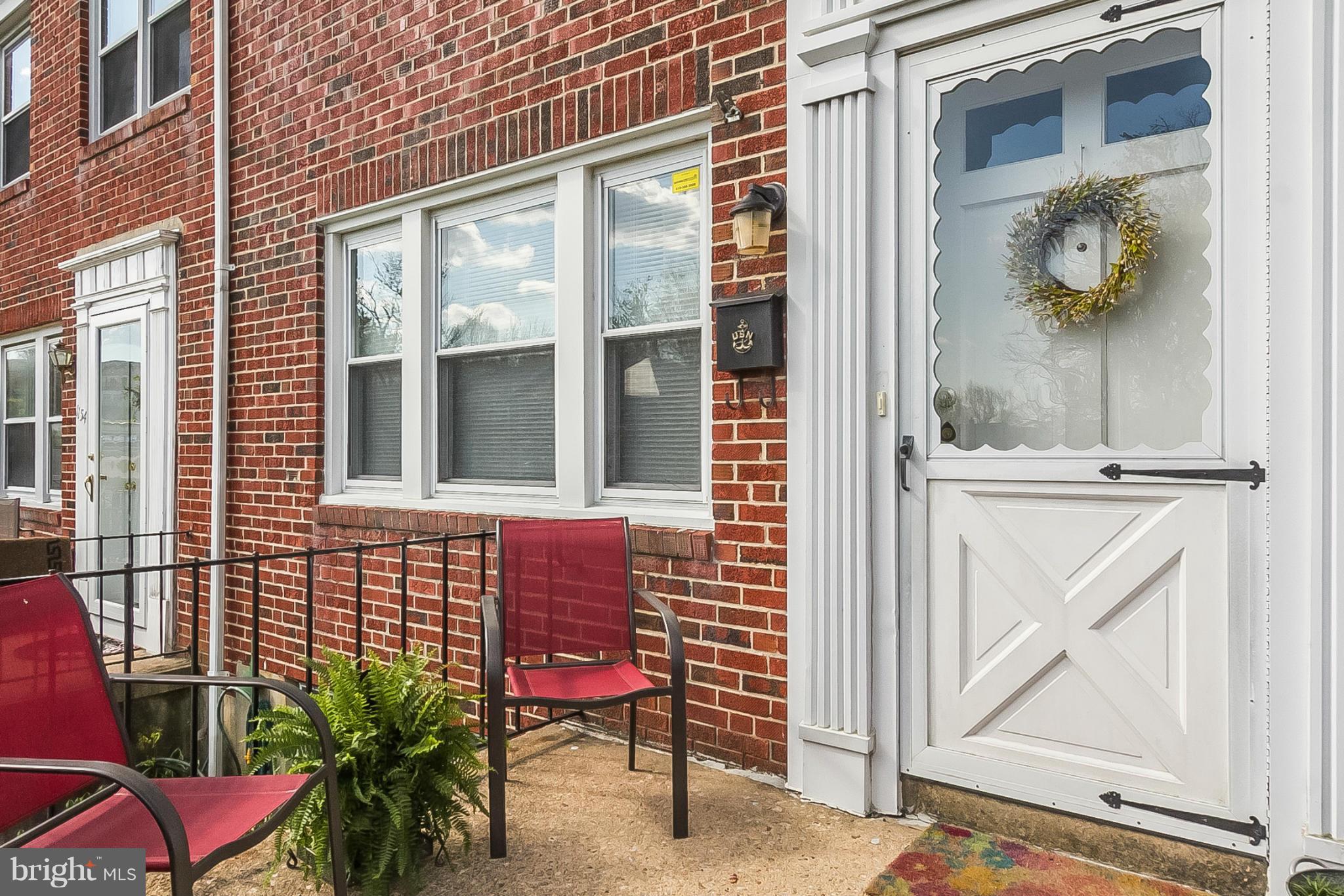 1156 Newfield Road Baltimore, MD 21207 - Photo 2 of 23 a view of front door of house with outdoor seating