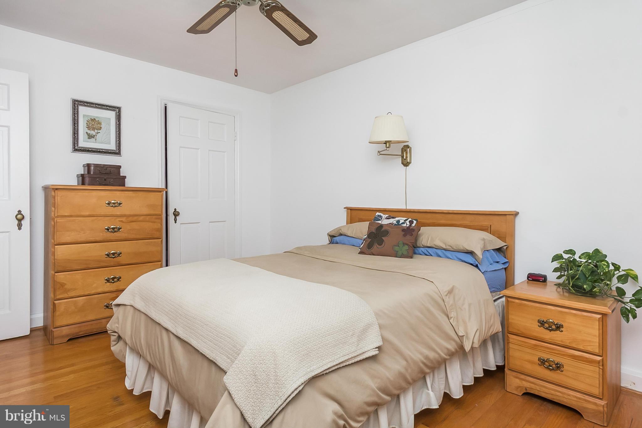 1156 Newfield Road Baltimore, MD 21207 - Photo 19 of 23 a bedroom with a bed and a dresser