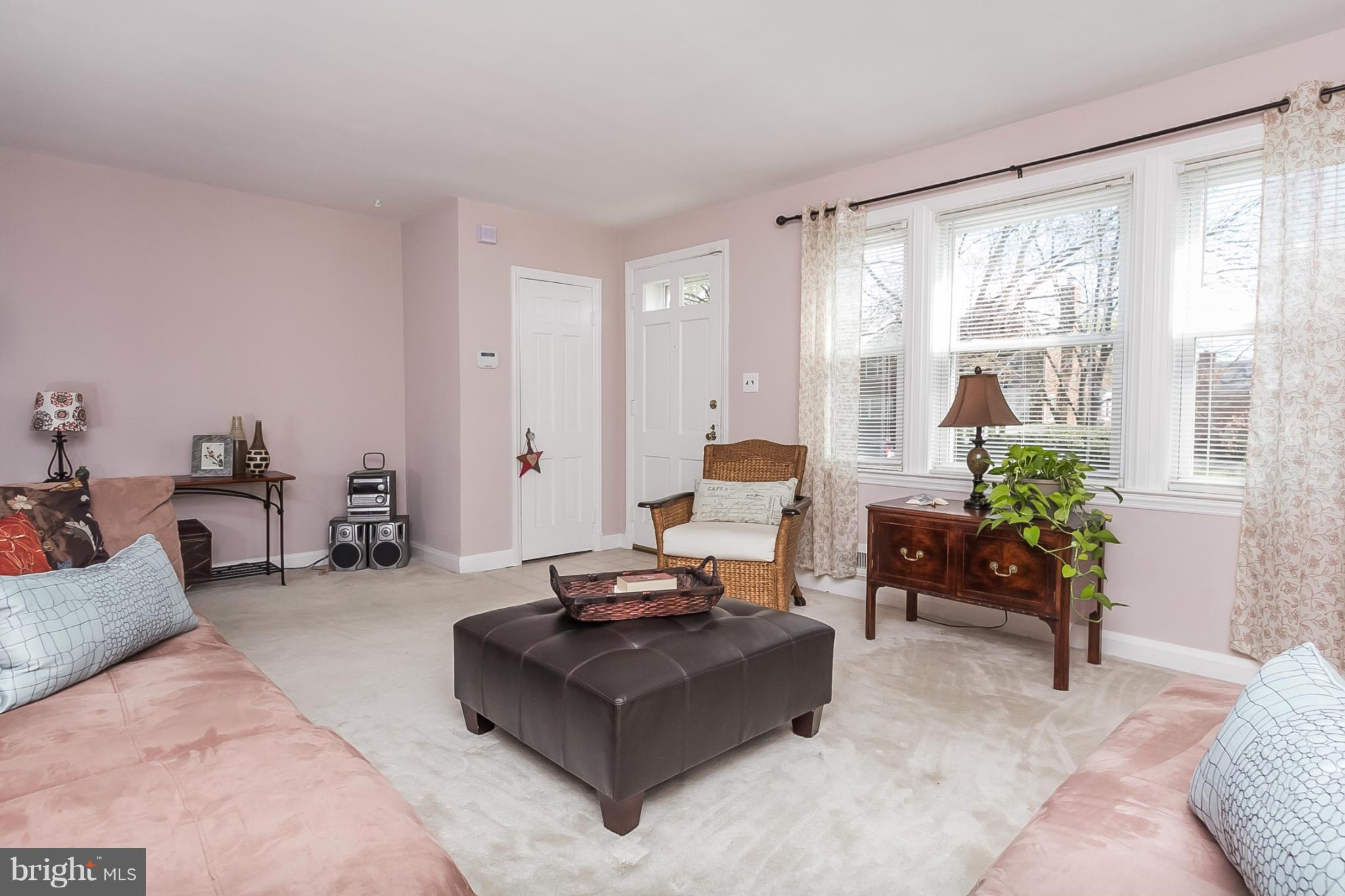 1156 Newfield Road Baltimore, MD 21207 - Photo 5 of 23 a living room with furniture and large windows