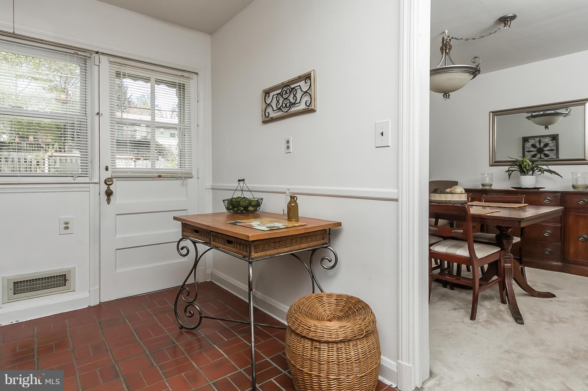 1156 Newfield Road Baltimore, MD 21207 - Photo 9 of 23 a view of a workspace with furniture and a window