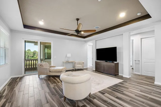 a large white bathroom with a granite countertop sink mirror and a bathtub
