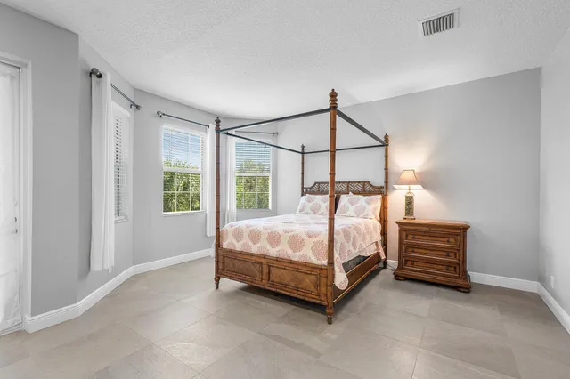 a bathroom with a sink vanity granite and a mirror