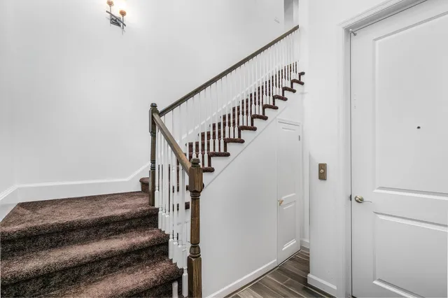an aerial view of a house with garden space and street view