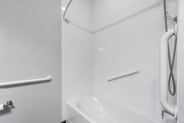 an aerial view of a house with garden space and lake view