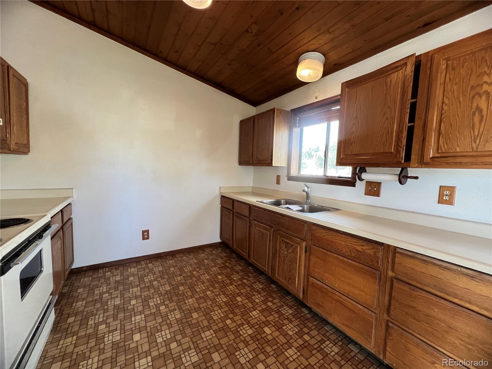 52 Deer Trail Drive Bailey, CO 80421 - Photo 11 of 40 a kitchen with sink and cabinets