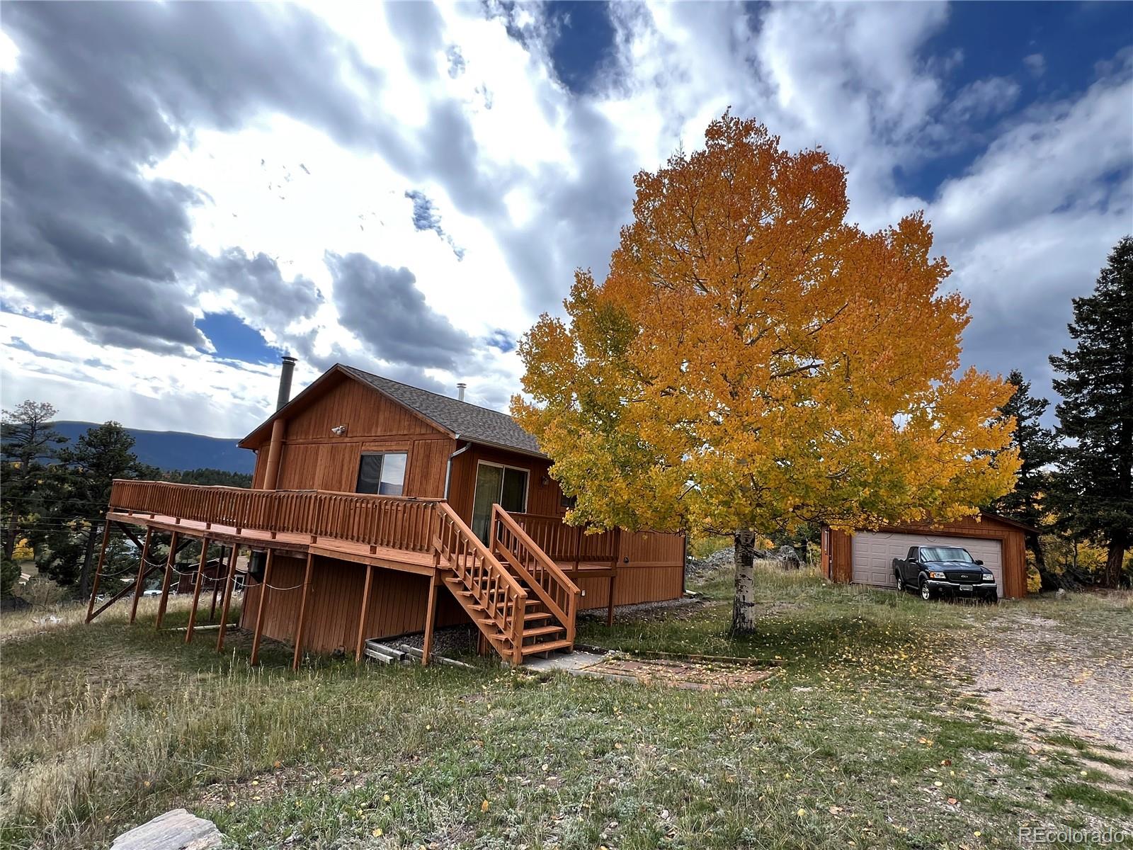 52 Deer Trail Drive Bailey, CO 80421 - Photo 2 of 40 a view of a house with a yard