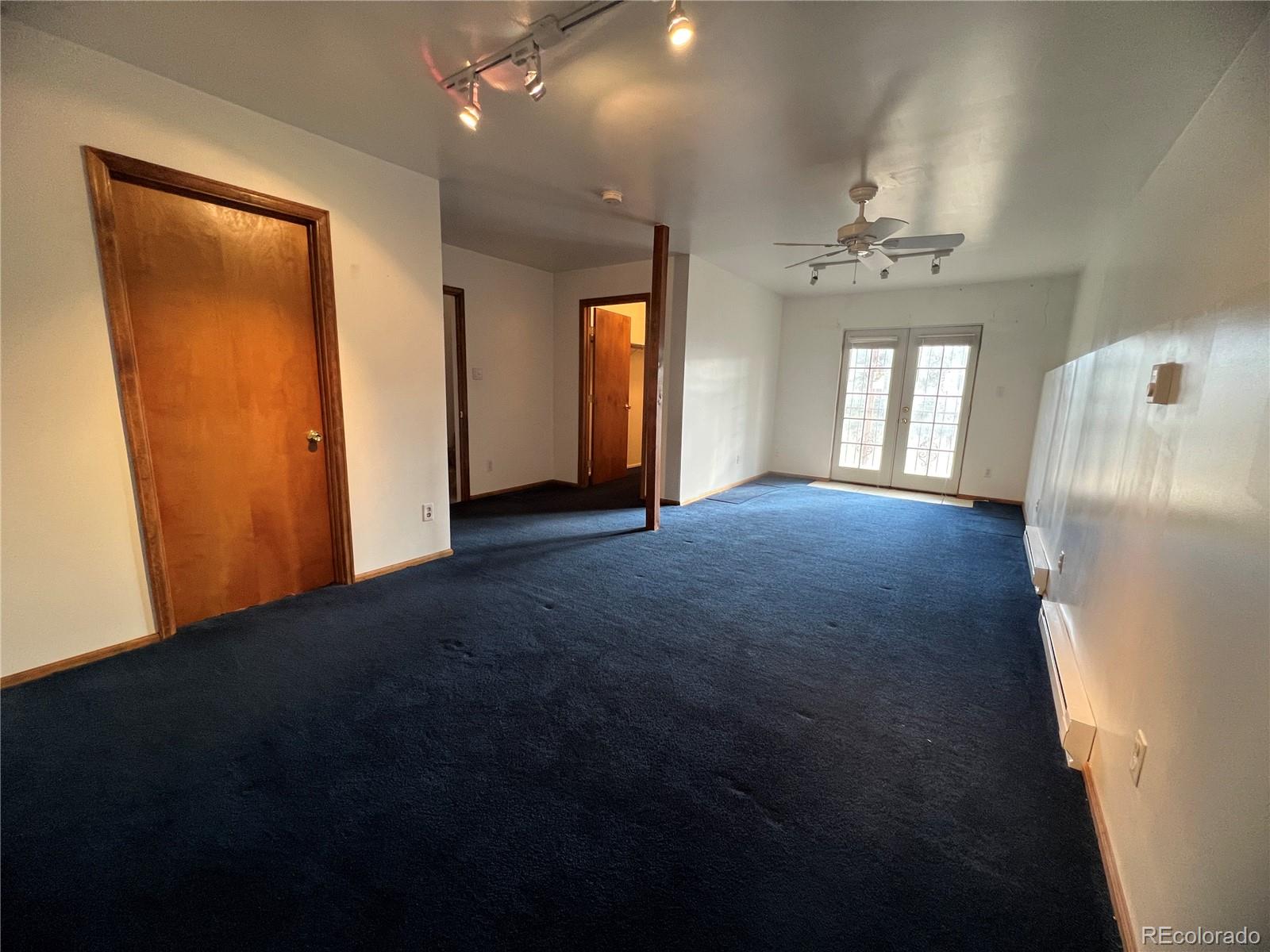 52 Deer Trail Drive Bailey, CO 80421 - Photo 23 of 40 an empty room with windows and closet