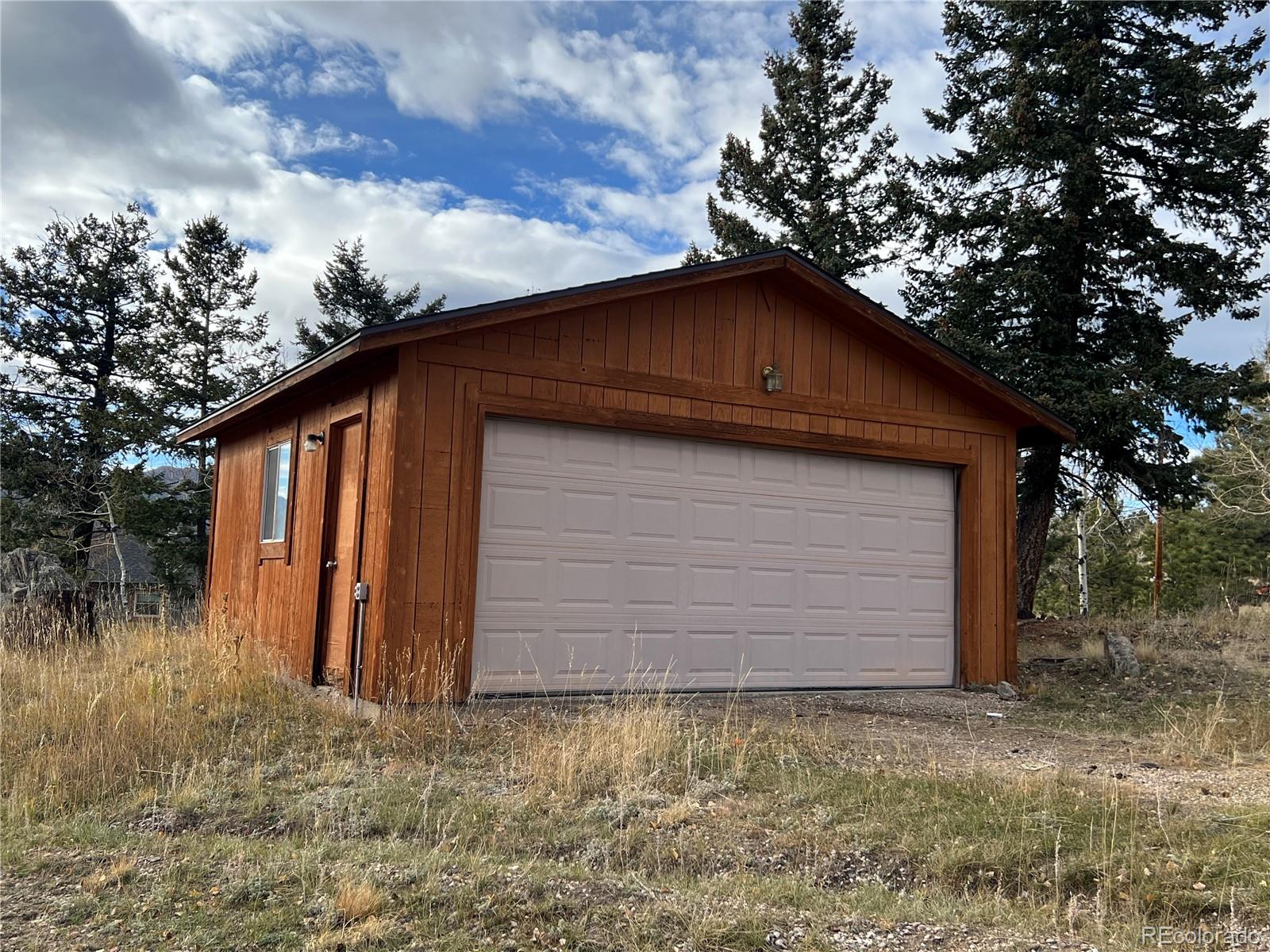 52 Deer Trail Drive Bailey, CO 80421 - Photo 31 of 40 a house with a yard