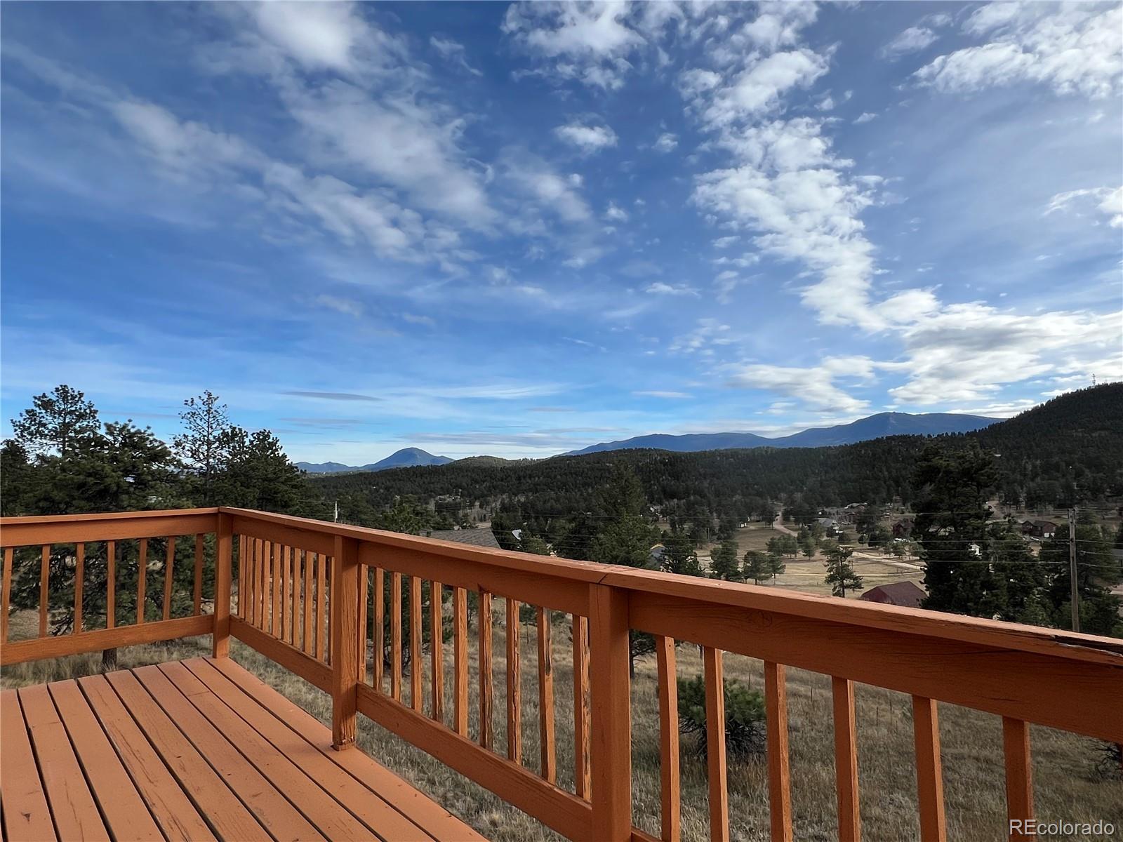 52 Deer Trail Drive Bailey, CO 80421 - Photo 4 of 40 a view of city and mountain from a balcony