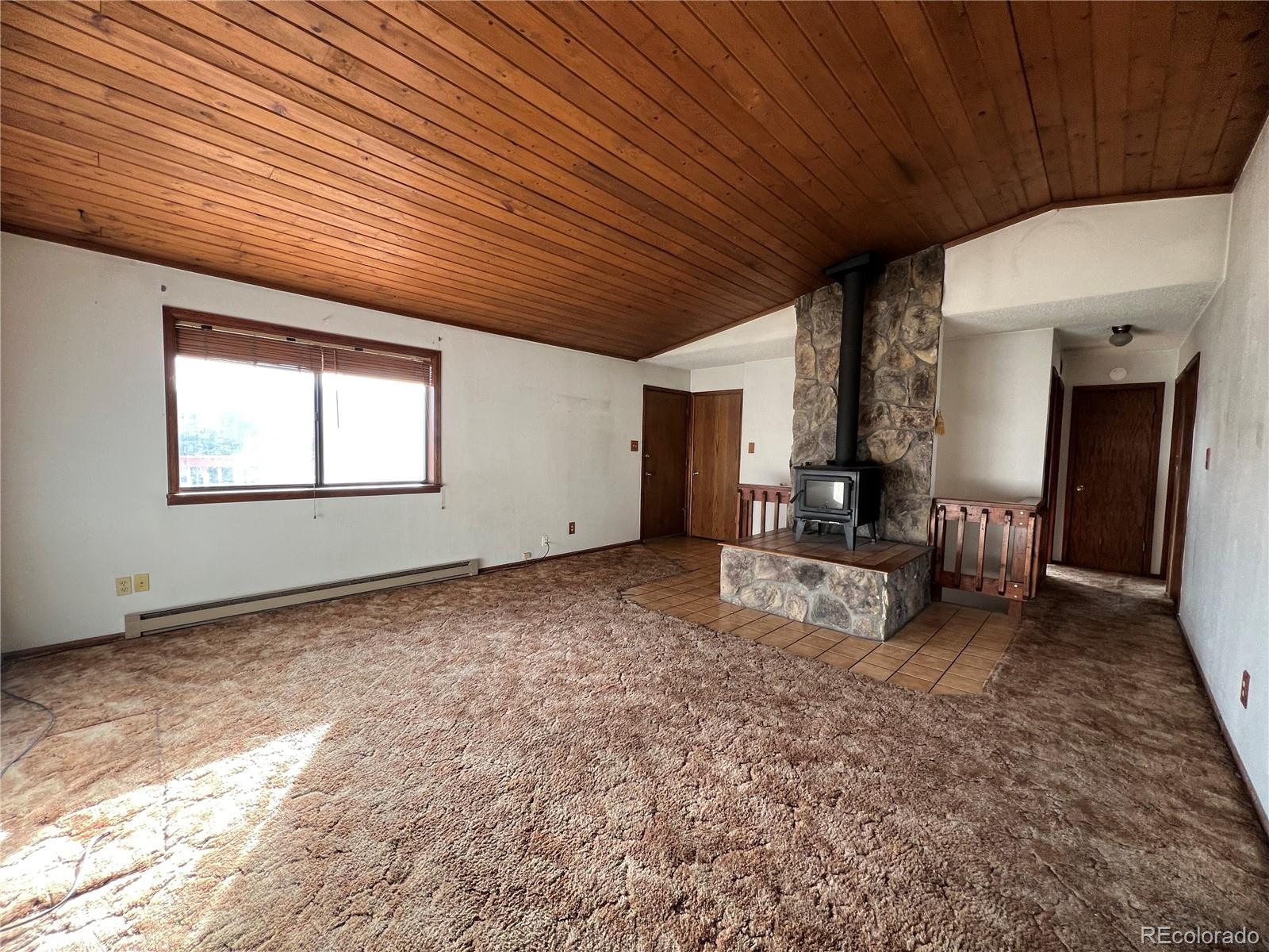 52 Deer Trail Drive Bailey, CO 80421 - Photo 5 of 40 a living room with furniture and a large window