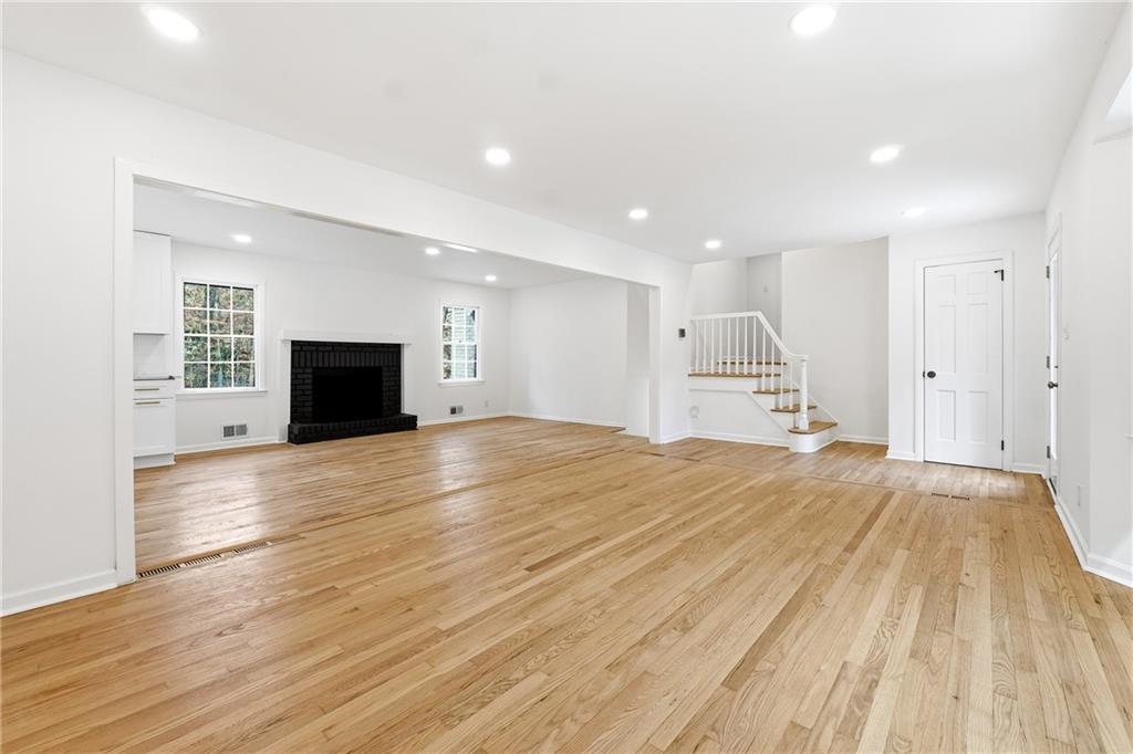 2520 Overlook Way Northeast Atlanta, GA 30345 - Photo 12 of 31 a view of empty room with wooden floor and fireplace