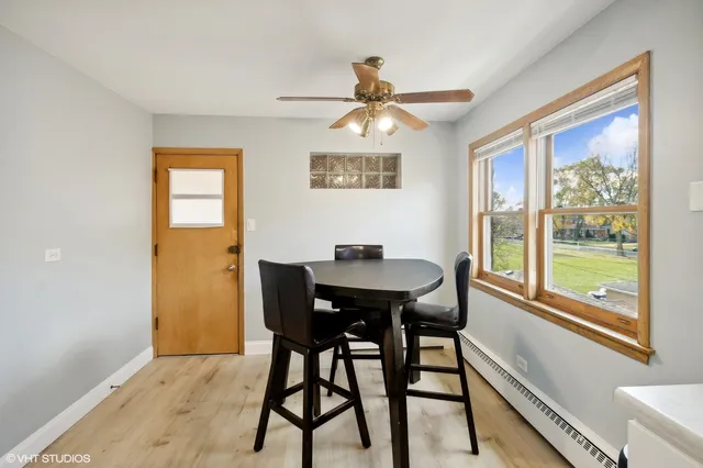 a view of a dining room with furniture window and outside view