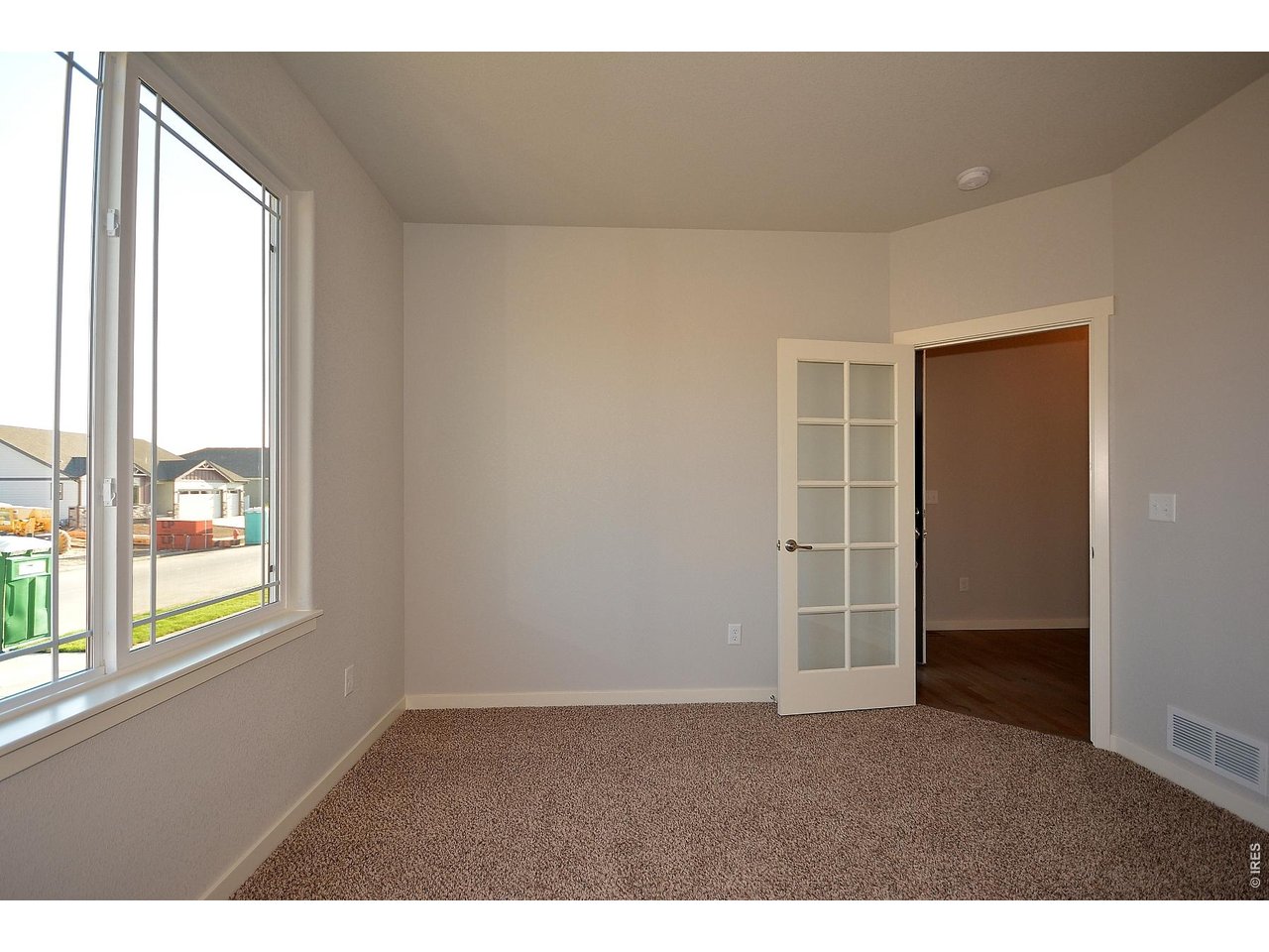 1145 Bitterroot Court Johnstown, CO 80534 - Photo 20 of 31 a view of an empty room with a window