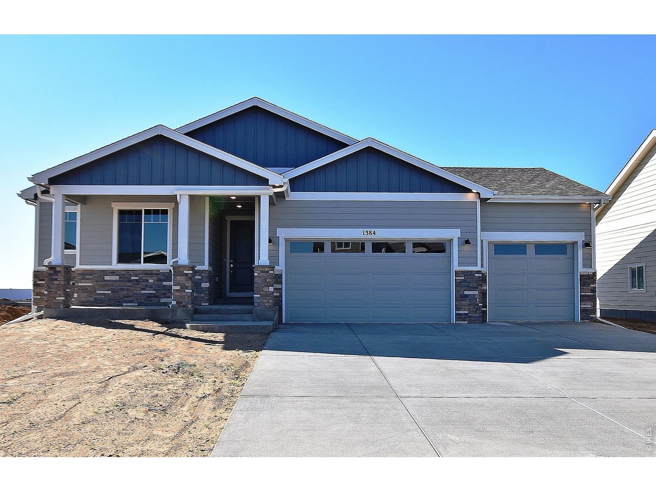 1145 Bitterroot Court Johnstown, CO 80534 - Photo 2 of 31 a front view of a house with a yard