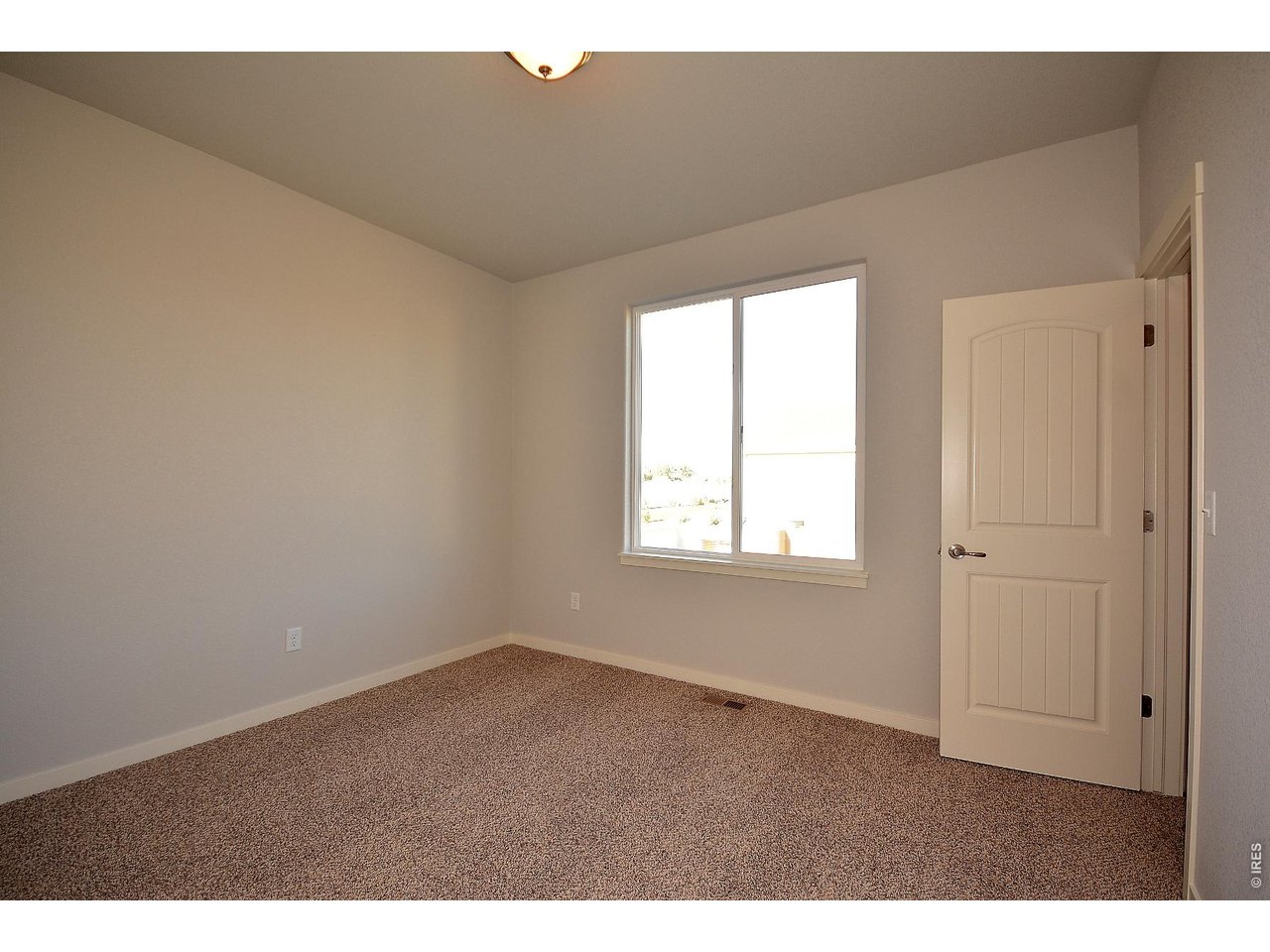 1145 Bitterroot Court Johnstown, CO 80534 - Photo 21 of 31 a view of an empty room and window