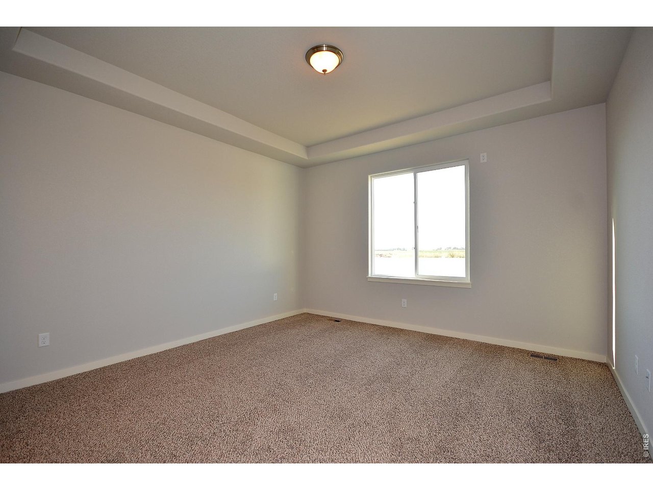 1145 Bitterroot Court Johnstown, CO 80534 - Photo 25 of 31 a view of an empty room with a window