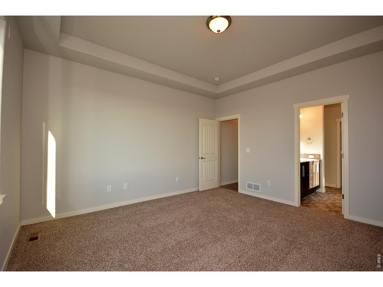 1145 Bitterroot Court Johnstown, CO 80534 - Photo 28 of 31 a view of an empty room and window