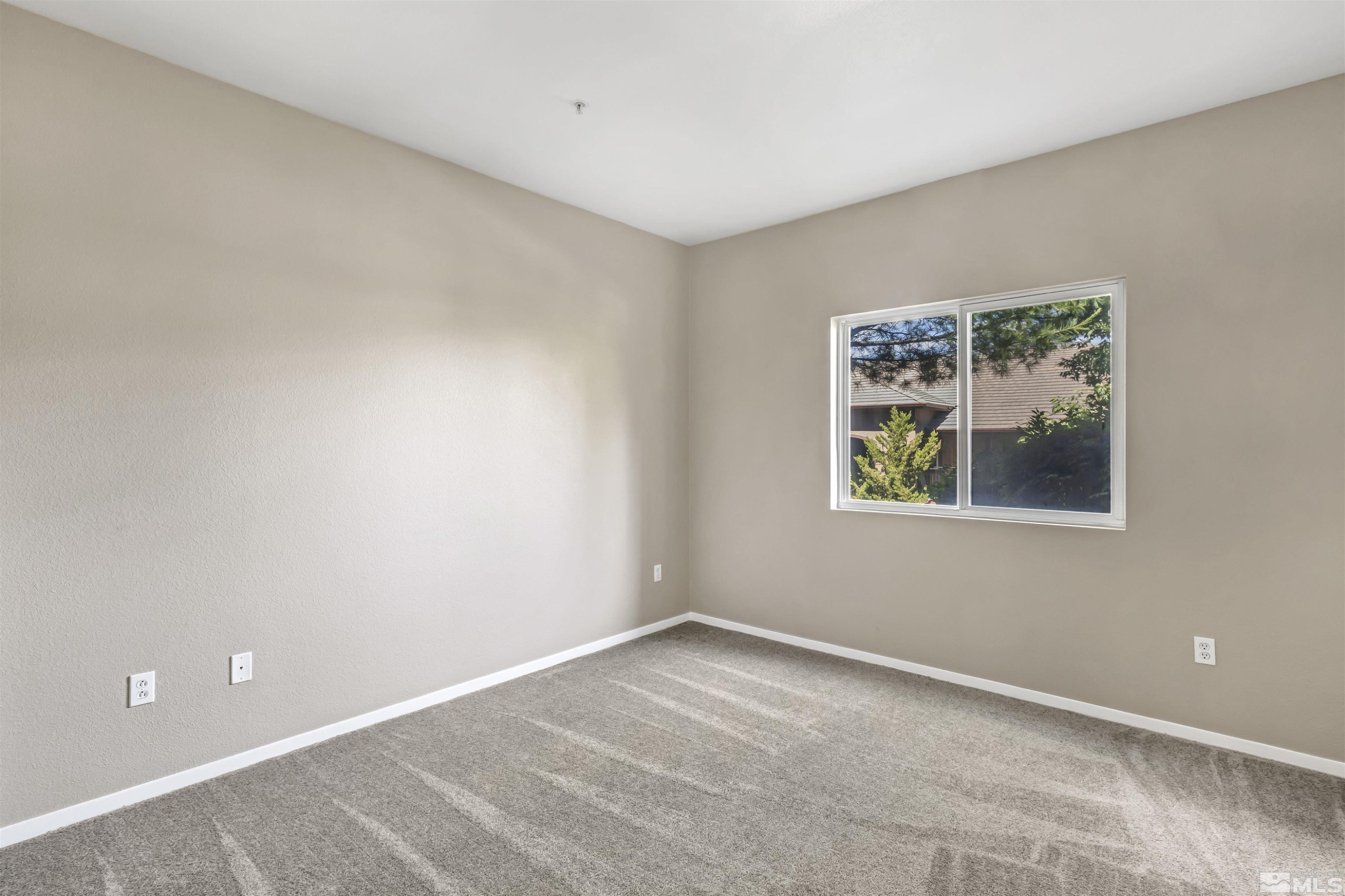 6850 Sharlands Avenue, Unit 1036 Reno, NV 89523 - Photo 18 of 36 a view of an empty room with a window