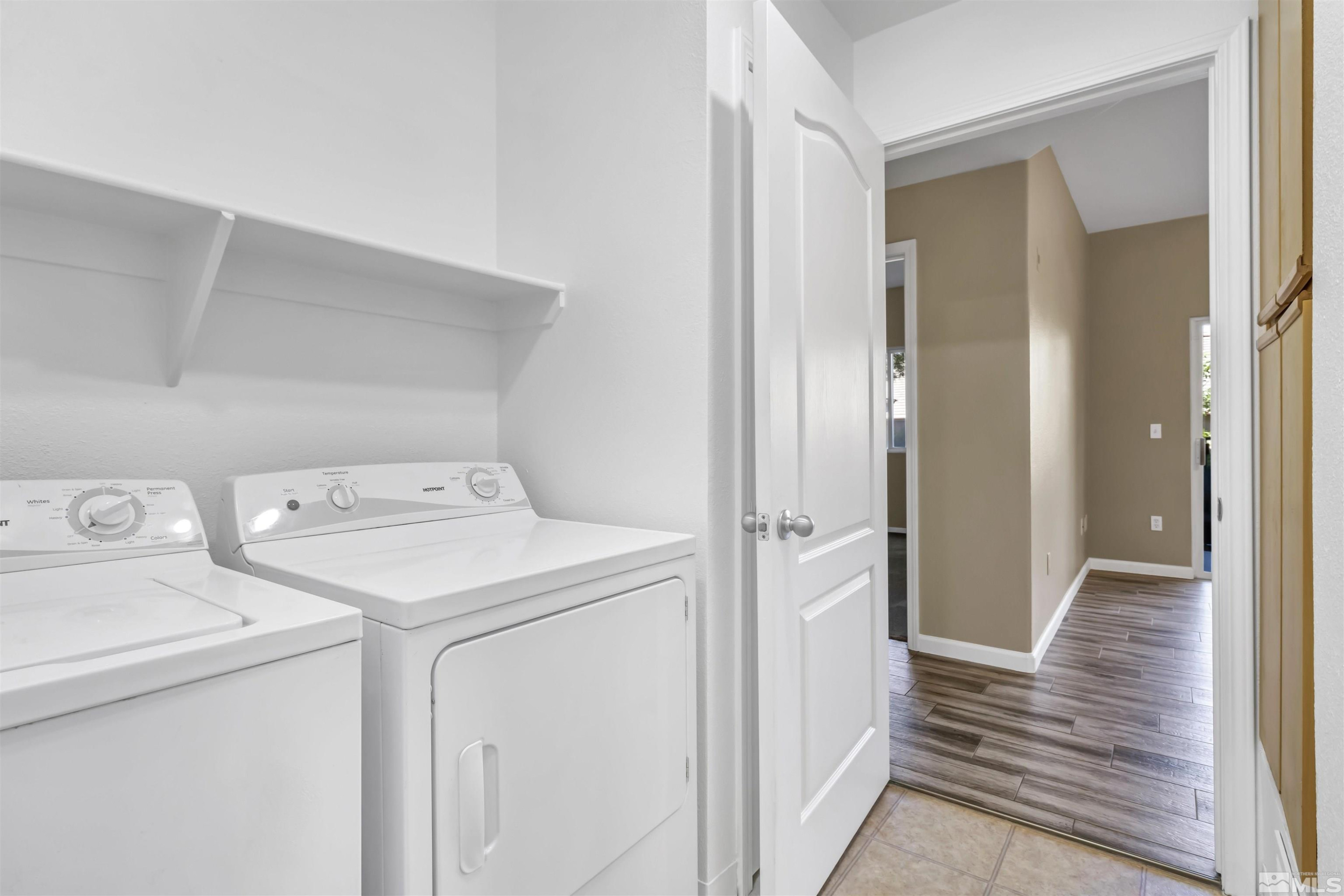 6850 Sharlands Avenue, Unit 1036 Reno, NV 89523 - Photo 24 of 36 a view of storage and utility room with washer and dryer