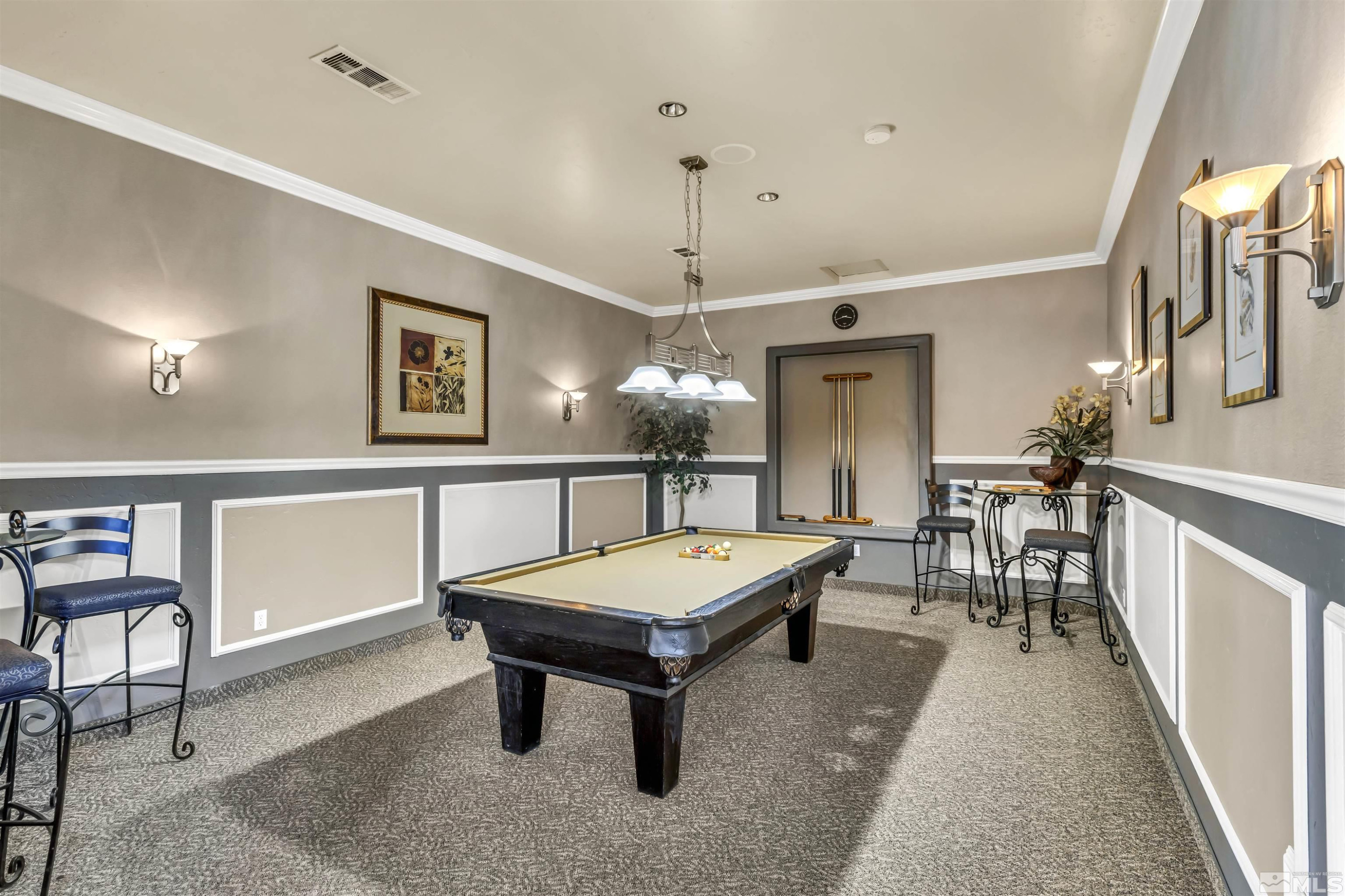 6850 Sharlands Avenue, Unit 1036 Reno, NV 89523 - Photo 33 of 36 a living room with furniture a chandelier and a dining table