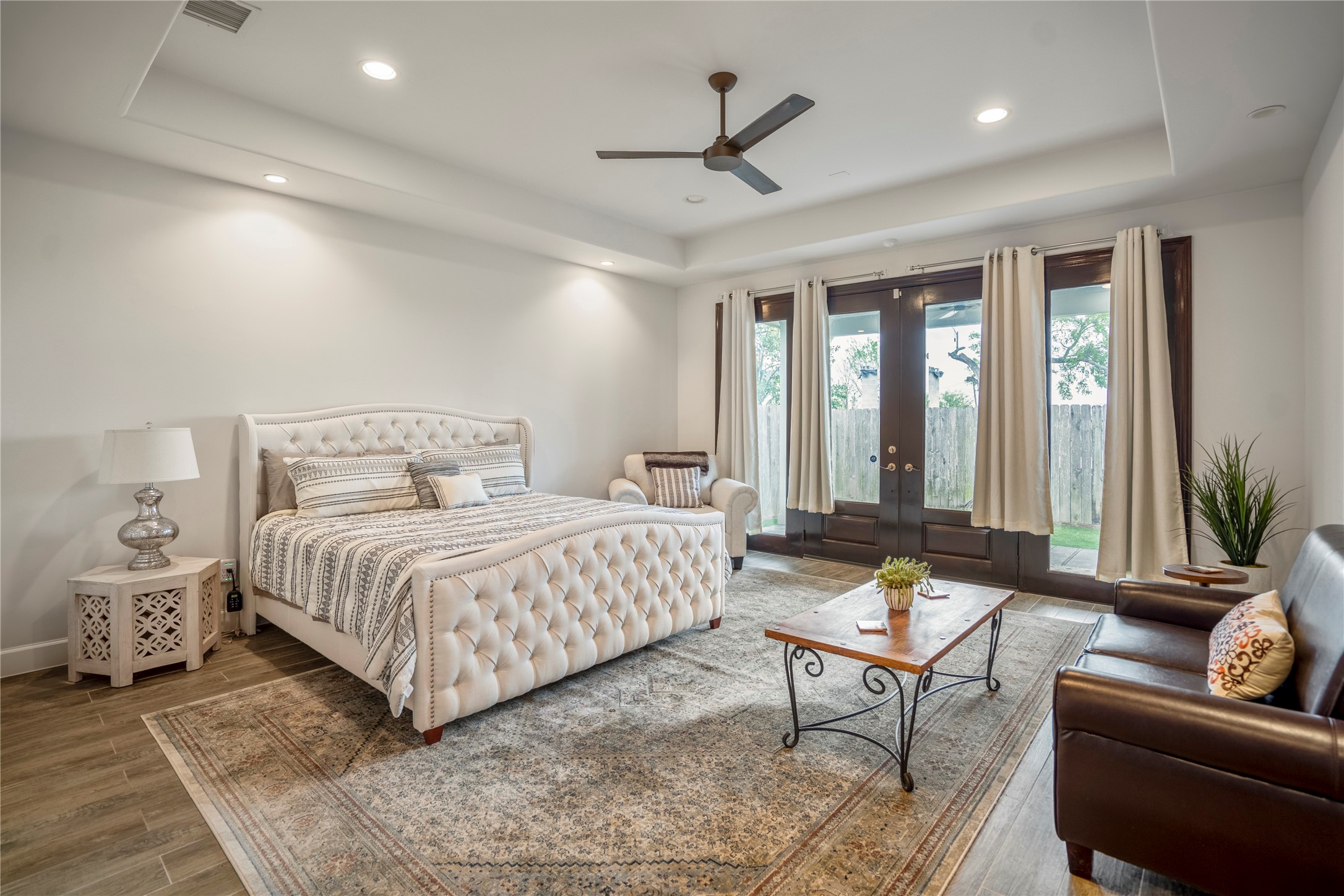 3202 Ozark Street Houston, TX 77021 - Photo 14 of 31 The primary first floor bedroom offers a relaxing retreat, with double doors leading out to the back patio and yard.
