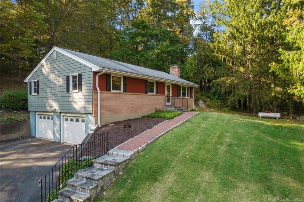 a view of house with backyard