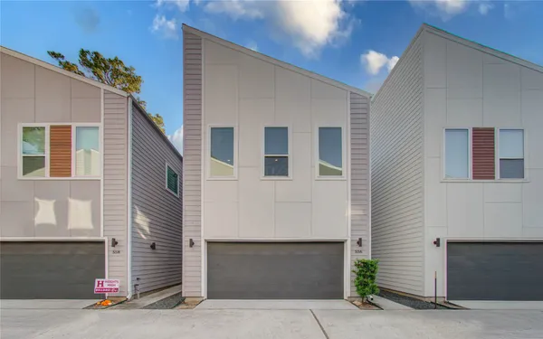 a front view of a house with garage
