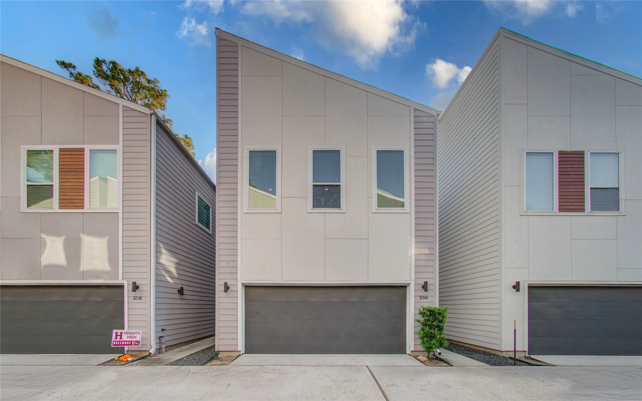 a front view of a house with garage